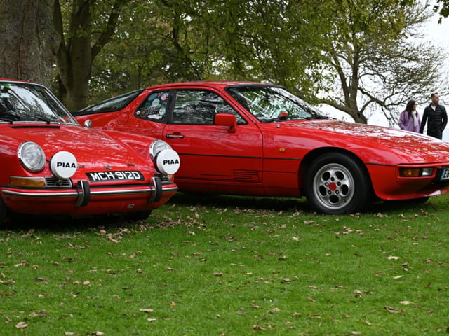 The glossy classic cars stood out amongst the autumnal falling leaves.