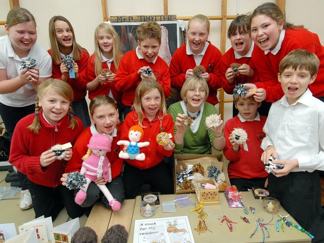 Getting crafty! Pupils from Rillington Primary School create cards and goods for their Christmas fair. Teacher Jo Craggs is pictured with the group.