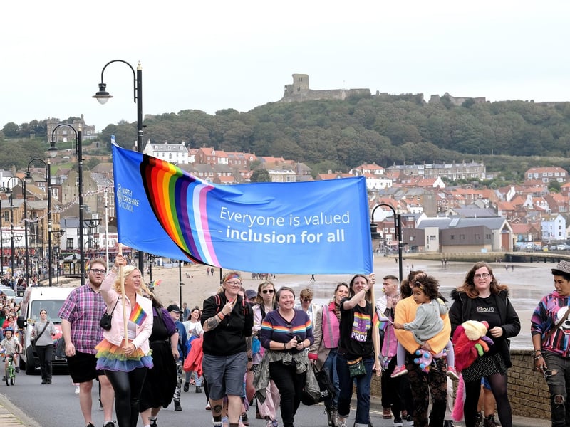 The parade passes along the seafront