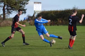 Heslerton Under 16 in blue in action against North Duffield Dragons.