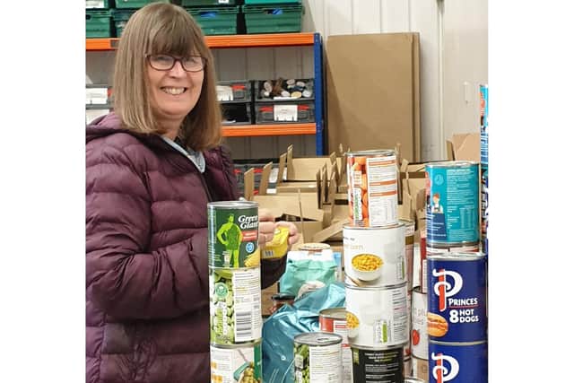Volunteer Tracy at the East Yorkshire Foodbank Warehouse organising tinned food to be sent to the vulnerable. Credit: EYFB/Mandy Thomlinson