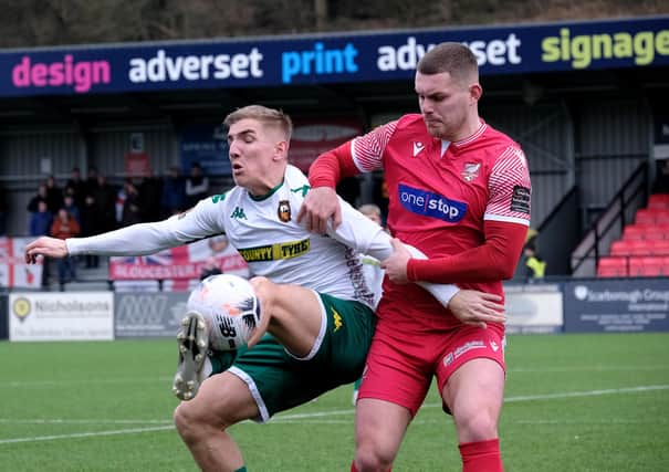 Boro defender Bailey Gooda gets to grips with a Gloucester City player during the hosts' 3-0 loss. PHOTOS BY RICHARD PONTER