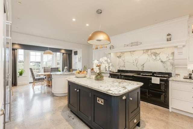 The extended kitchen with breakfast room is filled with high quality fixtures, fittings and appliances.