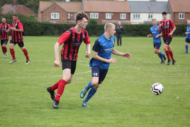 Liam Eyre, blue kit, scored for Edgehill Reserves in their 6-1 win.