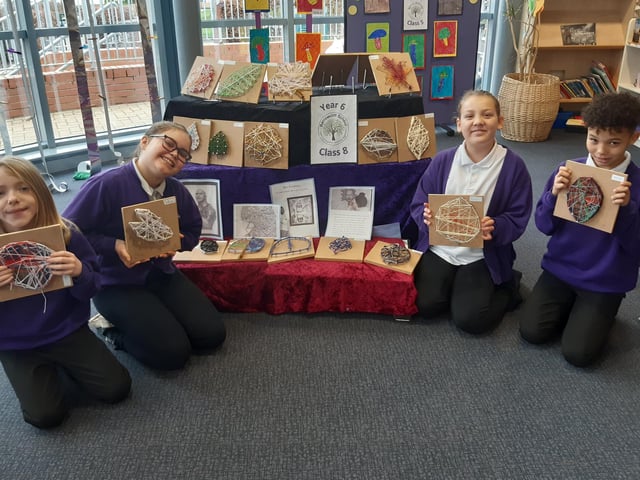 Year six youngsters master the intricate craft of string art.