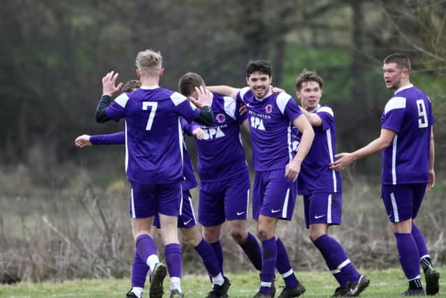 Tom Coates is congratulated on scoring one of his two goals for Spa