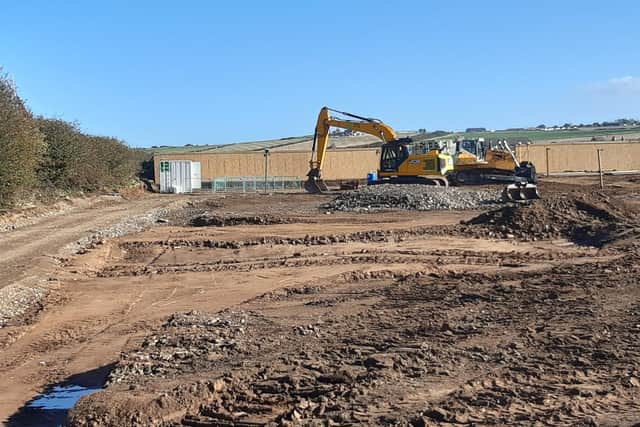 Diggers at the site off Green Lane, Whitby, which will see 60 new homes built.