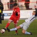 Brid Town's Matty Dixon clearing the ball from a Dunston attacker.