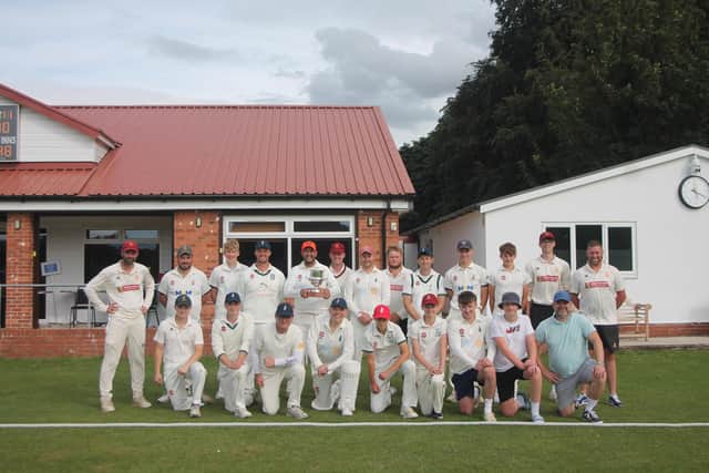 Pixies captain Adam Iyer pictured with the Worsley Cup and the Pocklington and Pocklington Pixies teams.