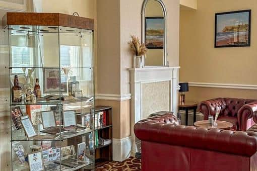 A display of artefacts from the hotel are shown off in the hotel lobby