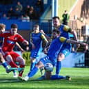 Dom Tear scores the late winner for Boro as they came back from 3-0 down to win 4-3 at King's Lynn Town on Easter Monday. PHOTOS BY ZACH FORSTER