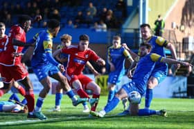 Dom Tear scores the late winner for Boro as they came back from 3-0 down to win 4-3 at King's Lynn Town on Easter Monday. PHOTOS BY ZACH FORSTER