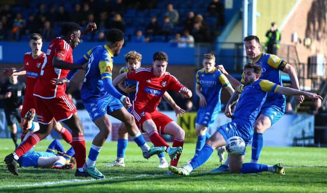 Dom Tear scores the late winner for Boro as they came back from 3-0 down to win 4-3 at King's Lynn Town on Easter Monday. PHOTOS BY ZACH FORSTER