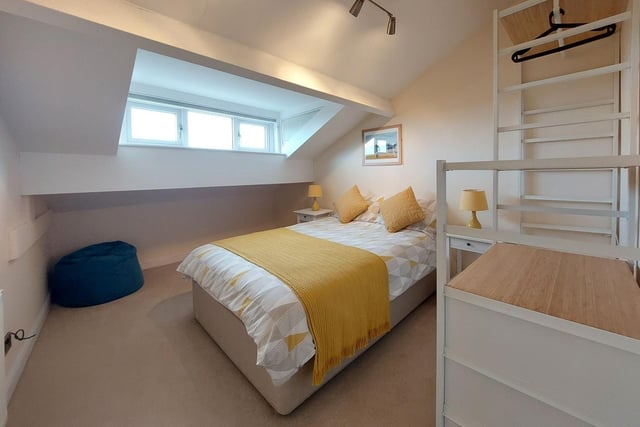 A bedroom in one of the top floor apartments.