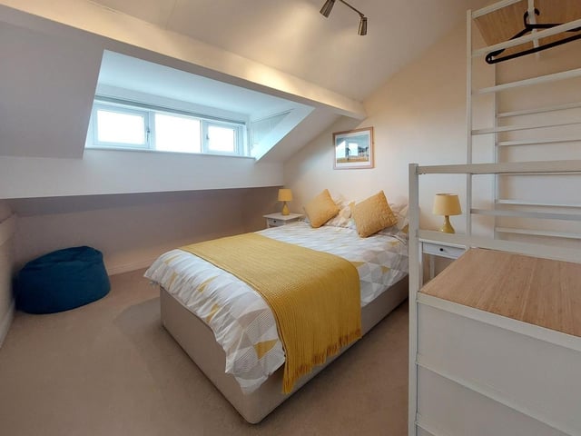 A bedroom in one of the top floor apartments.