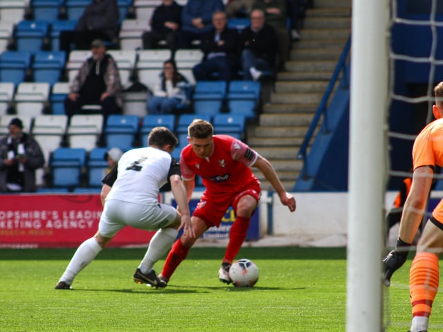 Jake Charles looks to pierce the home defence.
