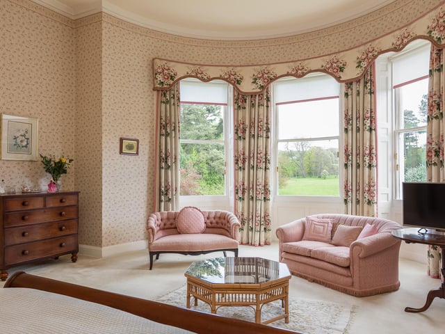 This exceptionally large bay window allows for extra seating within a bedroom and gives stunning views of the grounds outside.