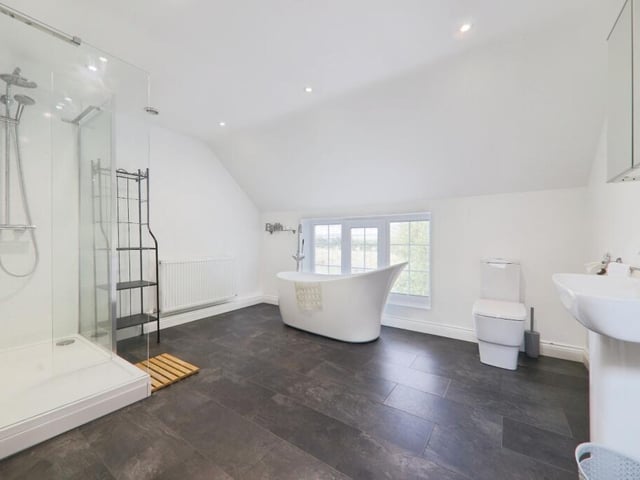A luxurious bathroom has a bath tub with a view.