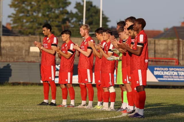 Minutes applause for Bridlington Town fan Paul Ashby before the draw at home to Whitby on Friday night. Photo by EC Media