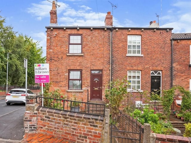 Situated next to the Queen Elizabeth Grammar School fields, and priced at £250,000, this home has a courtyard rose garden with stone steps and iron balustrade to the front door.