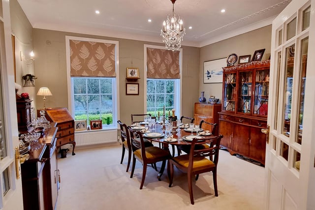 The formal dining room, with views of the garden.