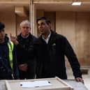 Britain's Prime Minister Rishi Sunak talks with trainees during a visit of the Construction Skills Village in Eastfield, near Scarborough, England.  
Photo by Darren Staples-WPA Pool/Getty Images.