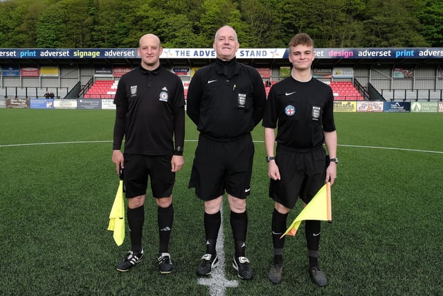 Referee John Chalk, centre, and his assistants before kick-off at the cup final.