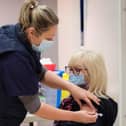 A patient receives their coronavirus vaccine at a walk-in centre in Scarborough.