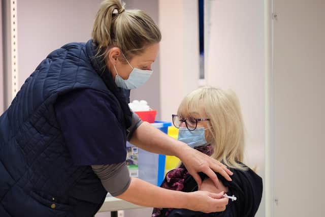 A patient receives their coronavirus vaccine at a walk-in centre in Scarborough.