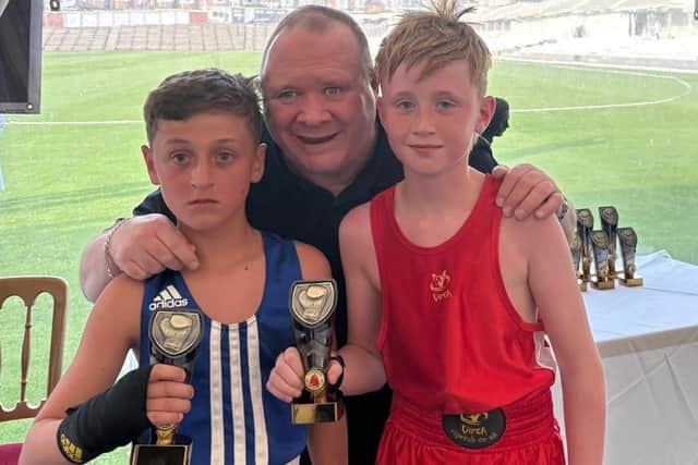 Paul Ingle with Scarborough's Archie Goldstone (red) with Derry Harris (blue). Photo by Glen Watkin Images