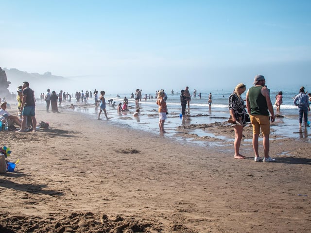 A busy beach on a warm but very foggy day!