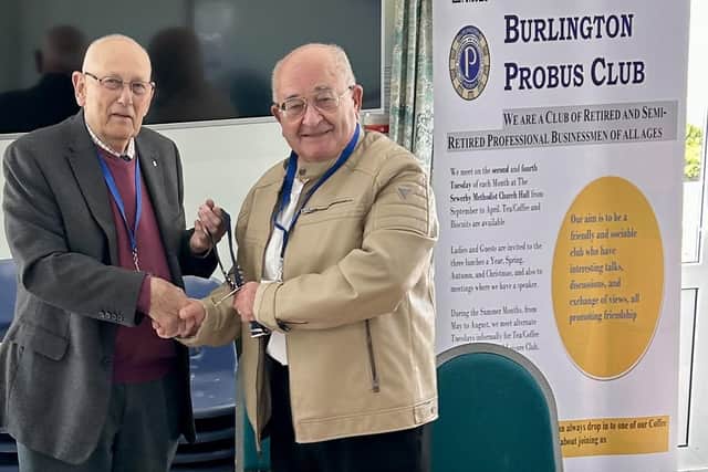 Outgoing Probus Club chairman Eric Butterworth hands over to Mike Gold, the chairman for 2025-2026.