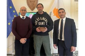 PC Bradley Hay (centre) meeting officials at the High Commission of Cyprus
