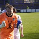 Keeper Shane Bland celebrates the late crucial win for Whitby at Lancaster City.