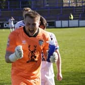 Keeper Shane Bland celebrates the late crucial win for Whitby at Lancaster City.