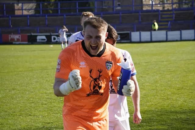 Keeper Shane Bland celebrates the late crucial win for Whitby at Lancaster City.