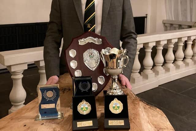 Rhys Buck with his haul of trophies at the WCC prize night.