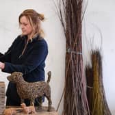 Whitby's Emma Stothard puts the finishing touches to willow sculptures of the Jack Russell Dogs, Beth and Bluebell, which are owned by The King and Queen.