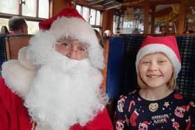 Santa greets a youngster on board The Santa Express
picture: Emma Atkins