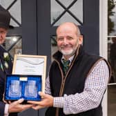 Simon Theakston, president of the Yorkshire Agricultural Society, presents John Beech, Mulgrave’s assistant rural surveyor, with a certificate and engraved crystal glasses at the Great Yorkshire Show.