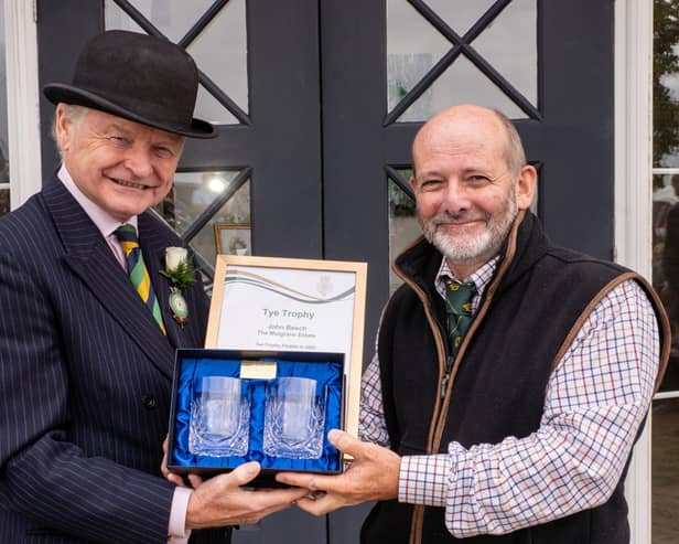 Simon Theakston, president of the Yorkshire Agricultural Society, presents John Beech, Mulgrave’s assistant rural surveyor, with a certificate and engraved crystal glasses at the Great Yorkshire Show.