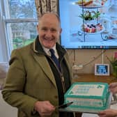 Kevin Hollinrake MP, with Alba Rose Care Home Registered Manager Tanya Thomas and a ‘Social Care First’ cake, made especially for the visit.