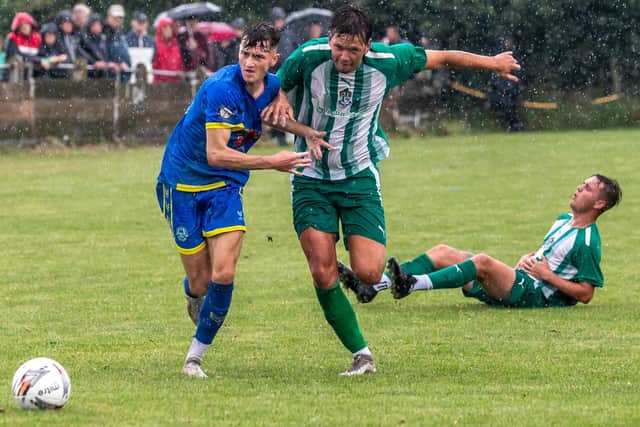 Fishburn Park, green and white stripes, battle it out with Pickering Toiwn.
