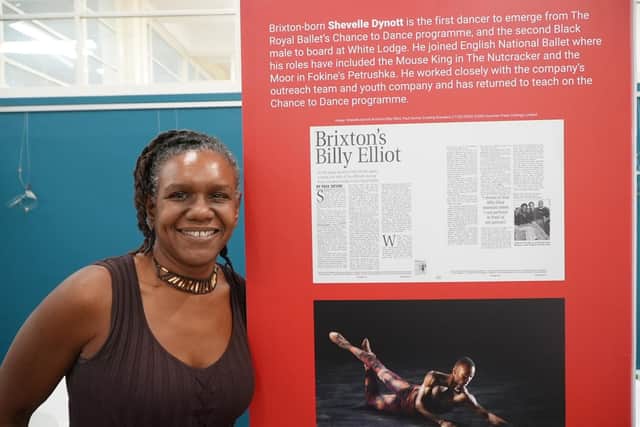 The director of Oxygen Arts, Marsha Lowe, showcasing the Light: Pioneers of Black British Ballet exhibition at Scarborough Library.