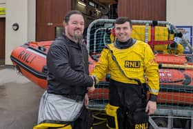 Adam Morland is congratulated after qualifying as a navigator. Photo: RNLI/Anna Needham