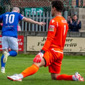 Brad Fewster races away to celebrate his opening goal in the 2-0 home win for the Blues against Atherton. PHOTOS BY BRIAN MURFIELD