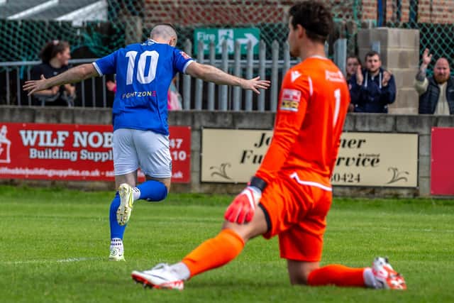 Brad Fewster races away to celebrate his opening goal in the 2-0 home win for the Blues against Atherton. PHOTOS BY BRIAN MURFIELD