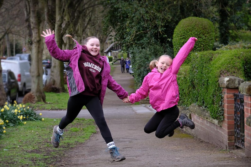 Sisters making leaps and bounds on the walk.