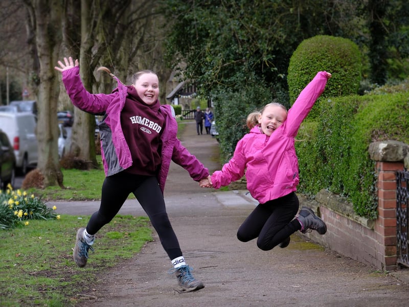 Sisters making leaps and bounds on the walk.