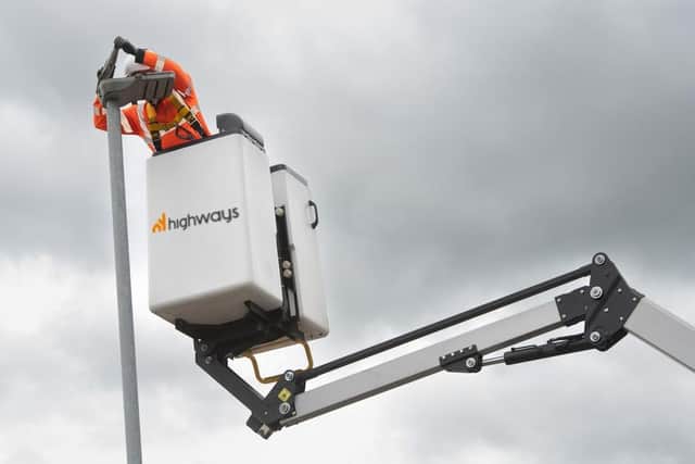 A North Yorkshire Council Highways officer replacing a street light with an LED alternative.